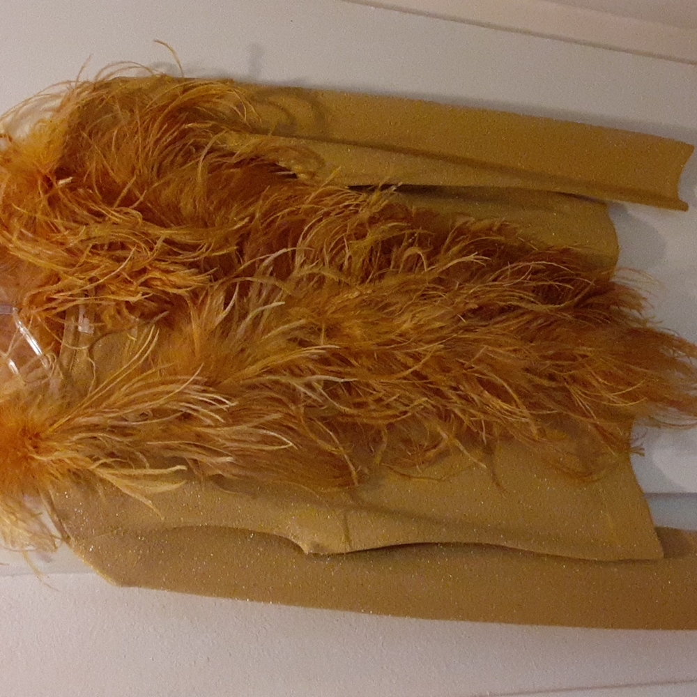Beautiful long sleeve golden sparkled sweater with feathers.